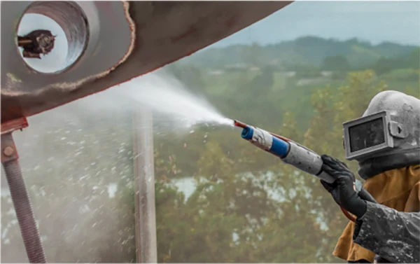 Man Using Grinding Wheel For Metal Refinishing